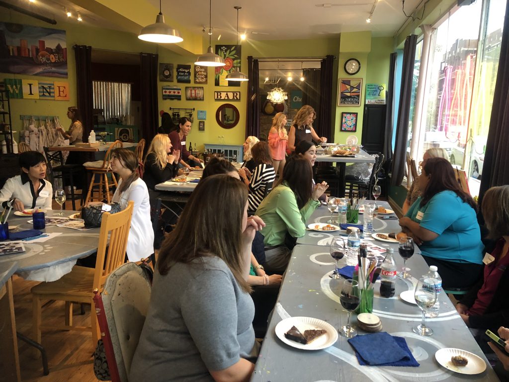 Group of women conversing at Women's Franchise Network - Chicago Fall Event at Bottle & Bottega